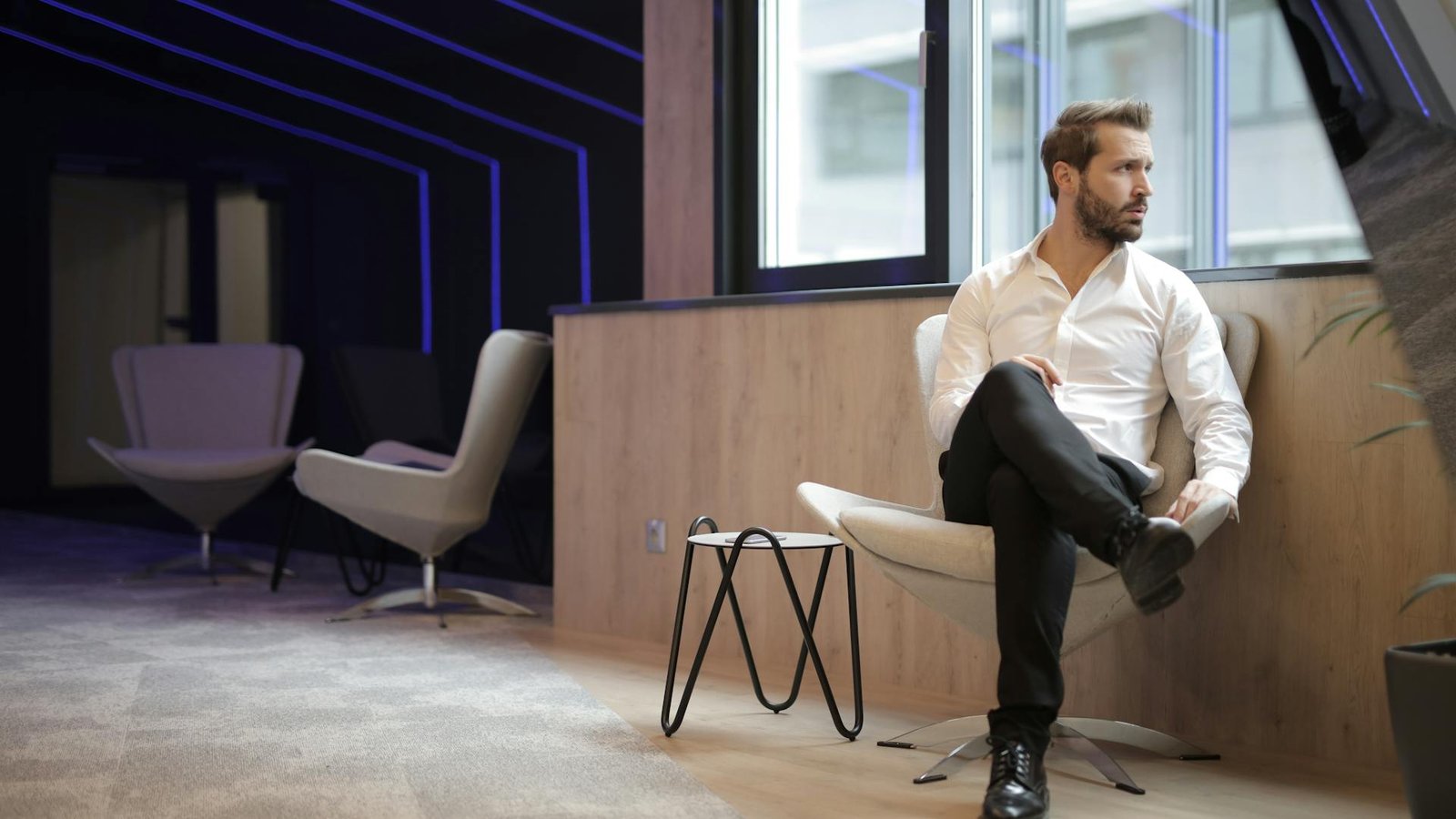 A managing partner reviewing case-growth reporting in a modern firm office