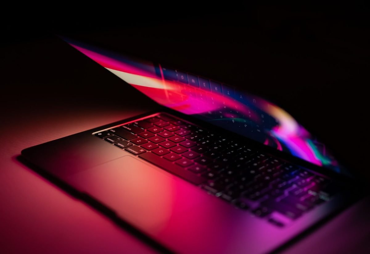 Laptop screen glowing in a dark room