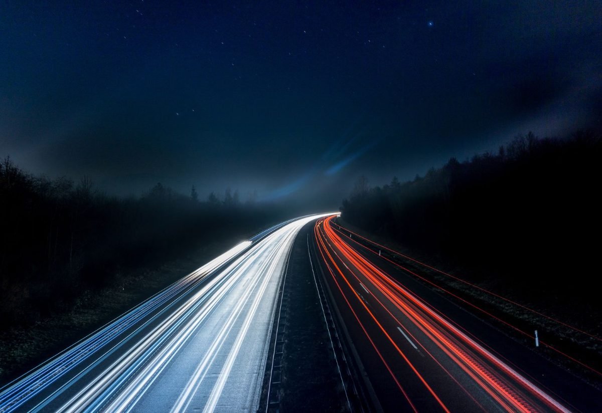 Light trails from traffic on a highway at night
